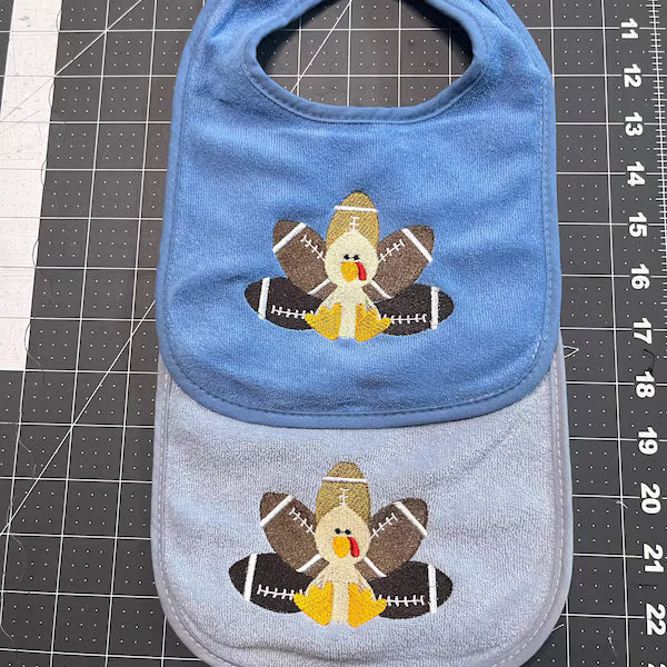 Stitch-out: Football Turkey Filled Machine Embroidery Design Embroidered on Two Onesies