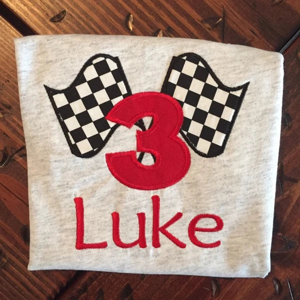 Racing Checkered Flag Applique Machine Embroidery stitch-out: Checkered Flag applique stitched out and personalized on a back of the shirt.