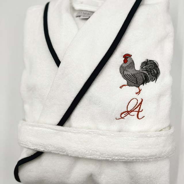 White Rooster Machine Embroidery Design stitch-out: White rooster stitiched out on a robe