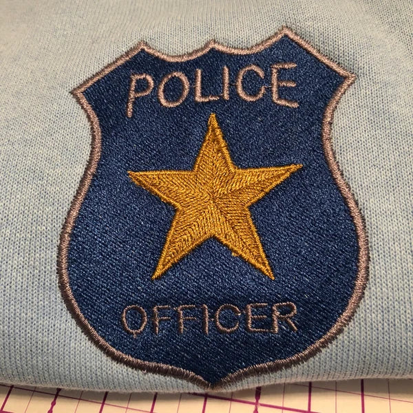 Stitch-out: Police Badge Machine Embroidery Design Embroidered on the Left Chest of a Grey T-Shirt
