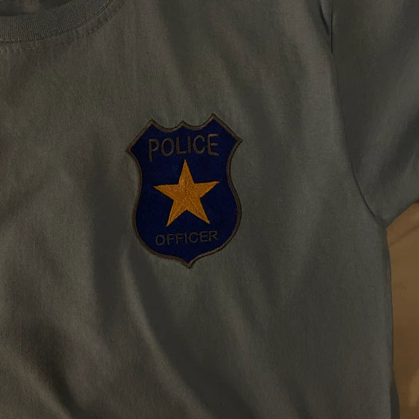 Stitch-out: Police Badge Machine Embroidery Design Embroidered left chest of grey shirt