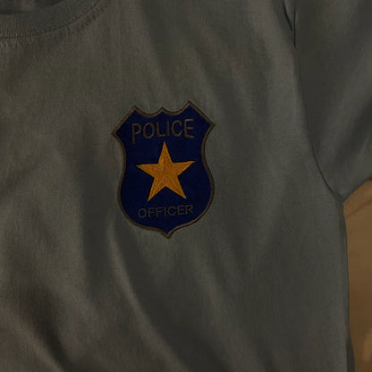 Stitch-out: Police Badge Machine Embroidery Design Embroidered left chest of grey shirt