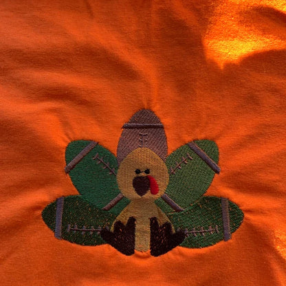 Stitch-out: Football Turkey Filled Machine Embroidery Design Embroidered on a Red Fabric