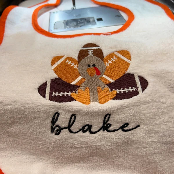 Stitch-out: Football Turkey Machine Embroidery Design Embroidered on Baby Bib Personalized with Name