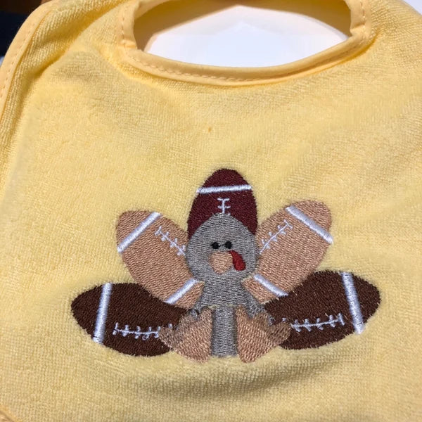 Stitch-out: Football Turkey Machine Embroidery Design Embroidered on Yellow Baby Onesie